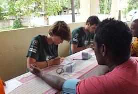 Volunteer Medicine & Healthcare A Public Health volunteer in Sri Lanka measures a local man's blood pressure, gaining important medical experience during her internship.