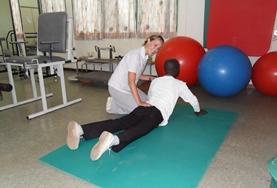 Volunteer Medicine & Healthcare A volunteer works with a patient on a Physiotherapy Project placement in Ghana
