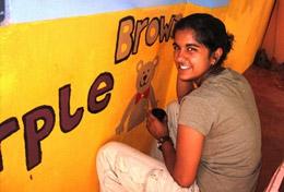 Volunteer Care A High School Special volunteer paints an educational mural at a school as part of her Care & Community work in Sri Lanka.