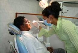 Volunteer Medicine & Healthcare A Dentistry High School Special volunteer teaches children how to brush their teeth correctly during an outreach in Sri Lanka.