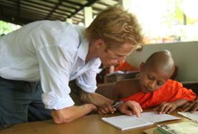 Volunteer Teaching A volunteer guides a young boy through his English homework at one of our Teaching placements in Sri Lanka.