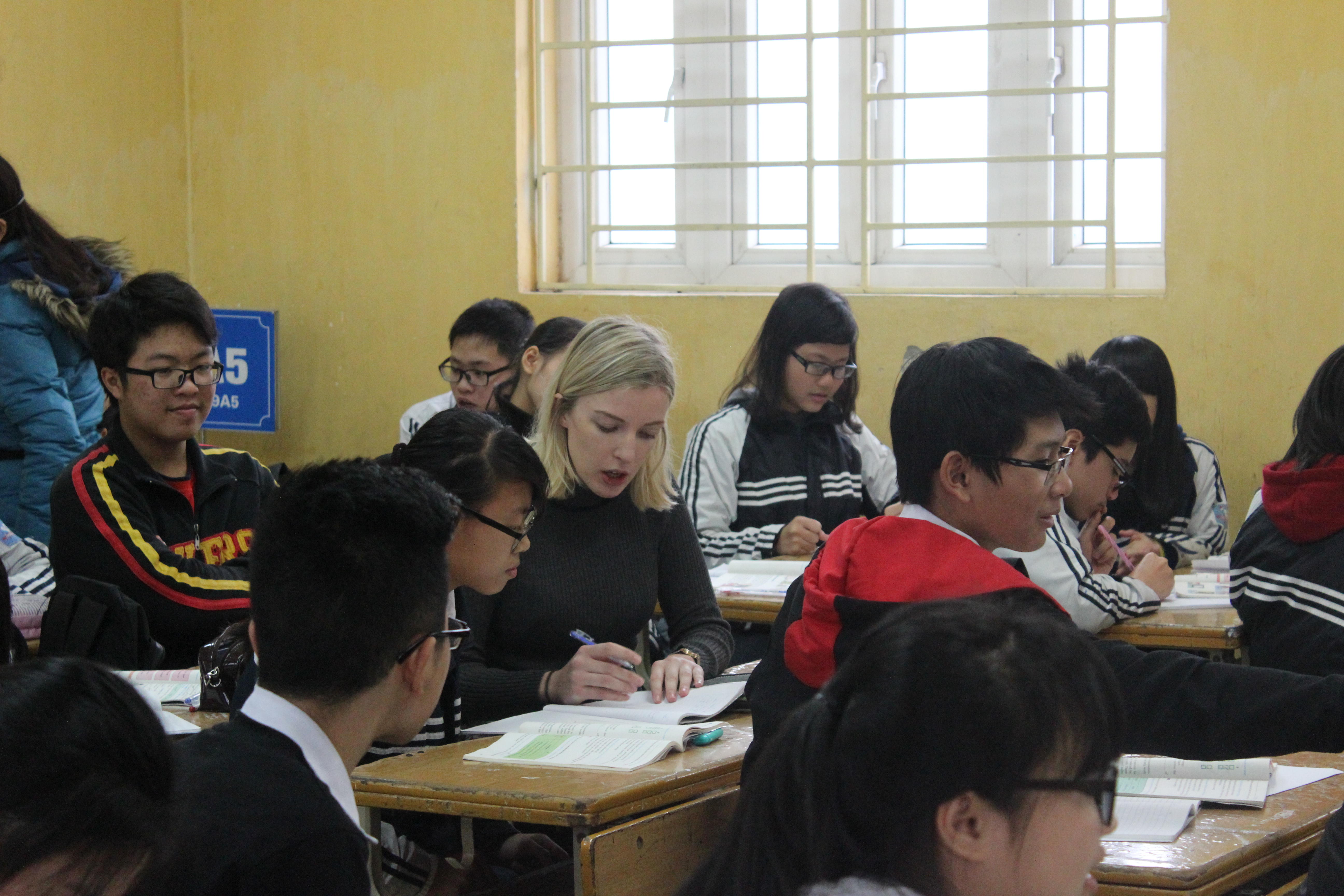 Volunteer Vietnam A French teaching volunteer assists a student at a placement in Vietnam