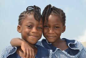 Volunteer Teaching Two children pose for a picture on a placement in Ghana