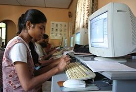 Volunteer Teaching A school student in Sri Lanka practises the computer skills taught to her on our volunteer Teach IT project.